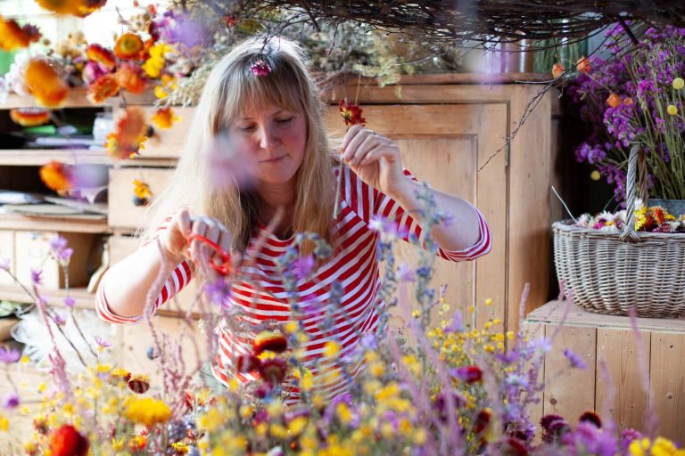 Sustainable interior everlasting floral sculpture designer Layla Robinson creating inside her Hay-on-Wye studio