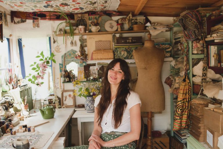 British illustrator and embroiderer Megan Ivy Griffiths inside her garden studio