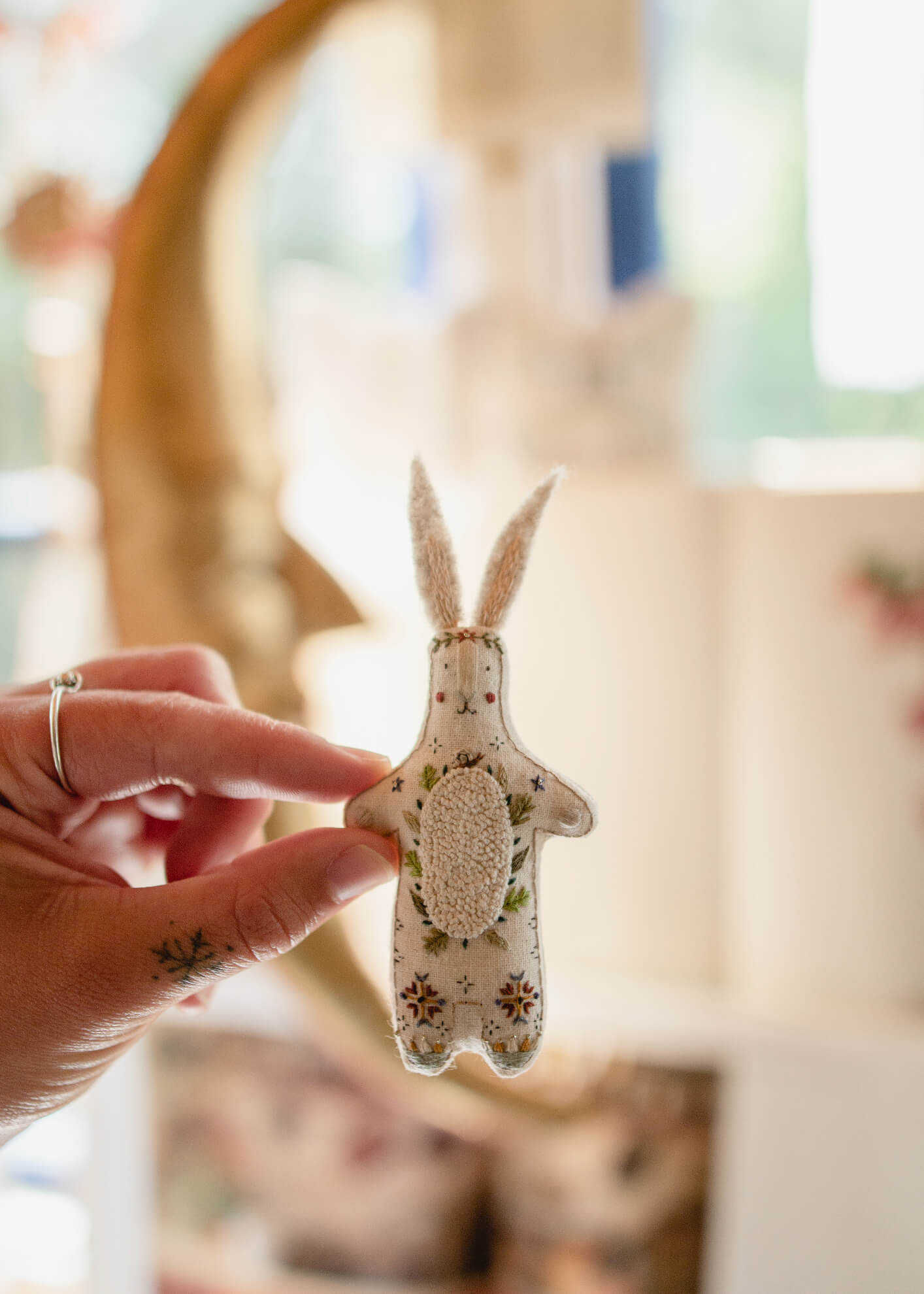 Folk inspired embroidered rabbit inside the bohemian studio of British illustrator and embroiderer Megan Ivy Griffiths