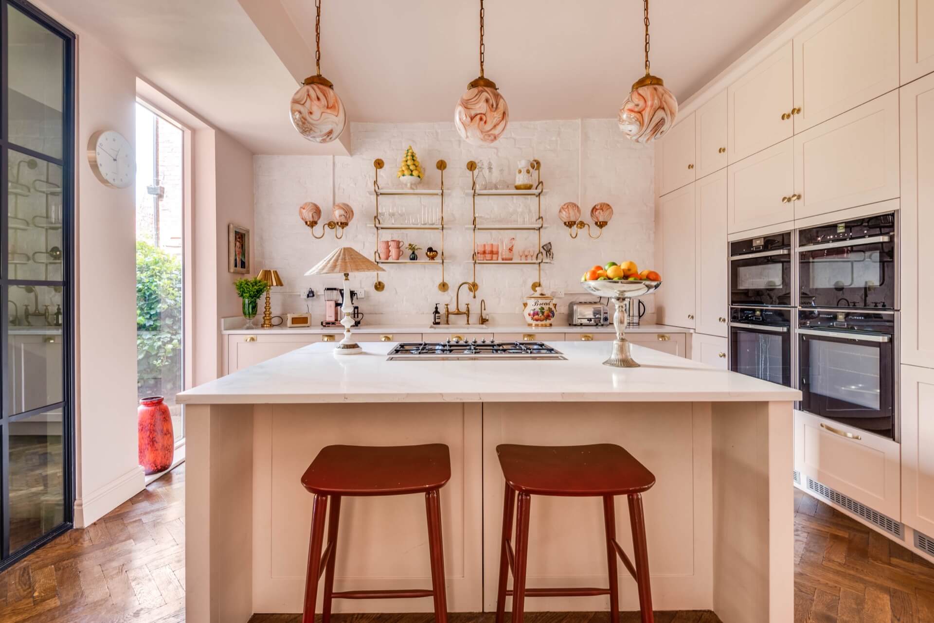 Kitchen with pale pink kitchen cabinets 