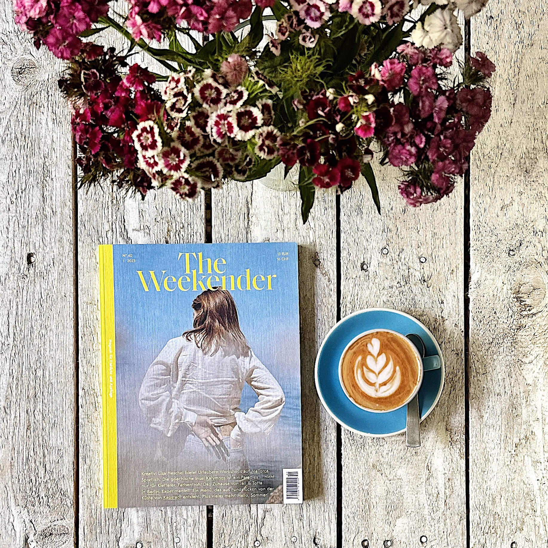 Independent magazine The Weekender with a coffee and flowers 
