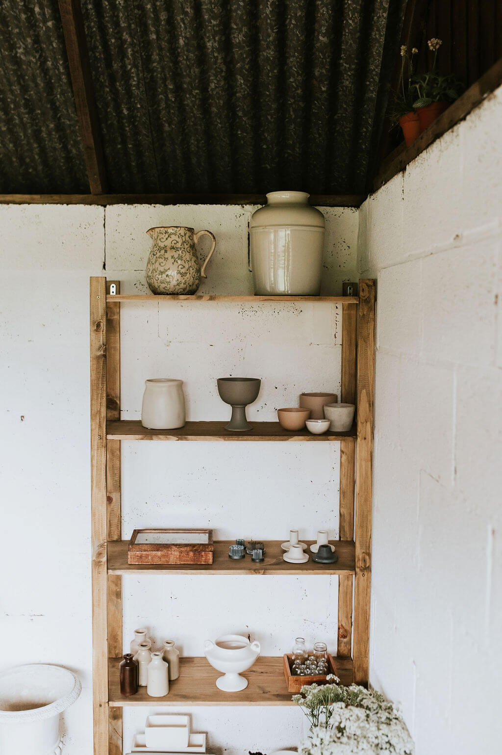 Pots and ceramics inside Tomoka India's midlands flower studio