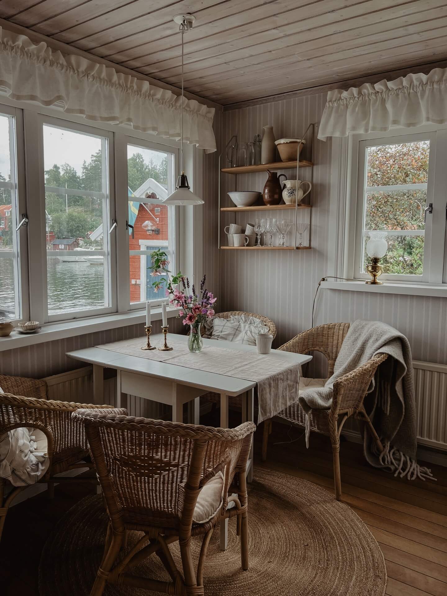 Emelie Sundberg home tour - interior of Swedish home with table and chairs by a window
