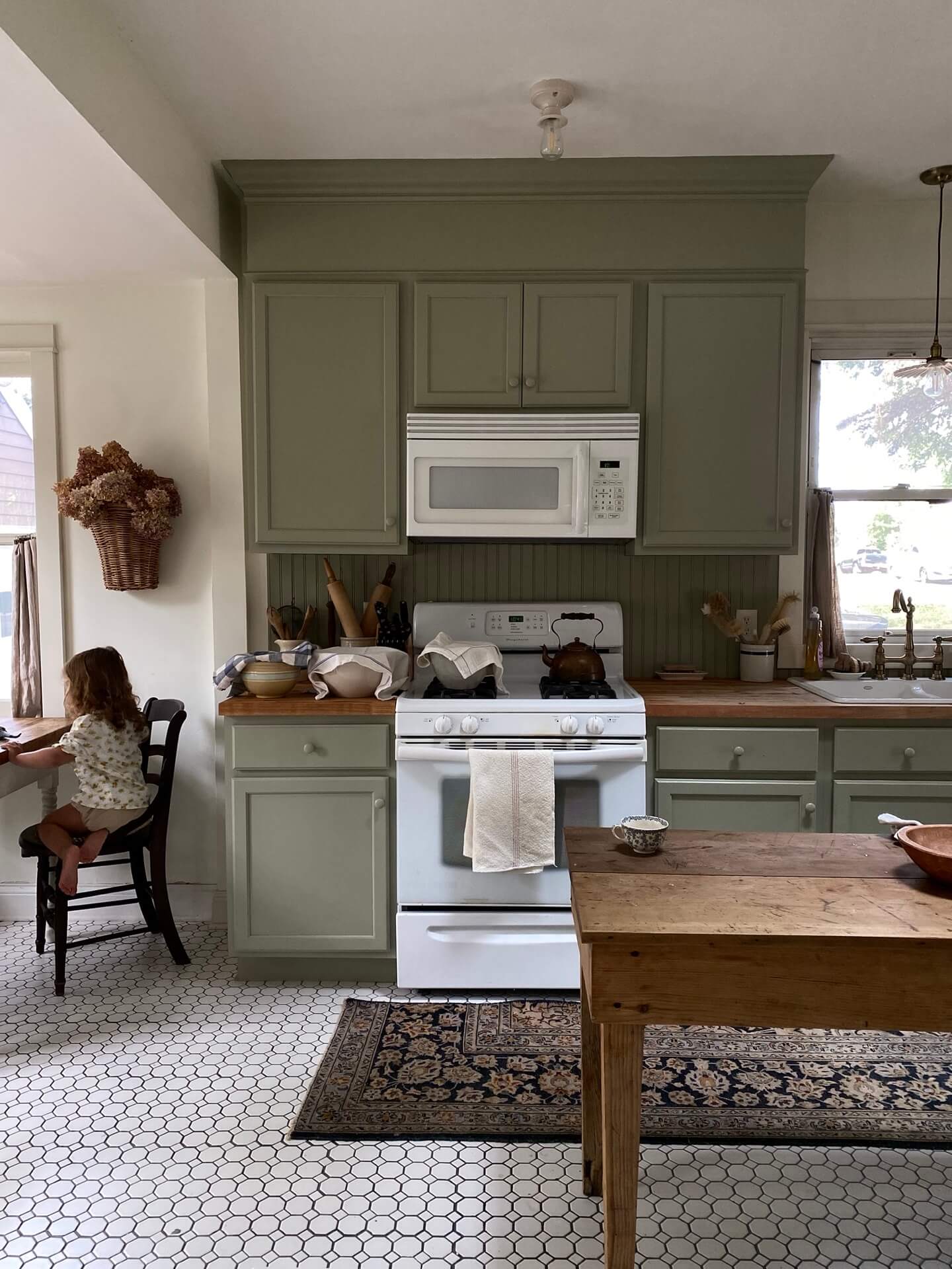 Country kitchen with forest green painted kitchen cabinets