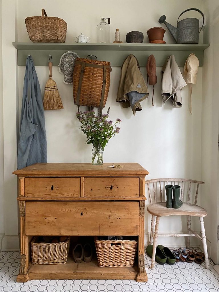vintage wooden furniture and a peg rail in a country style interior