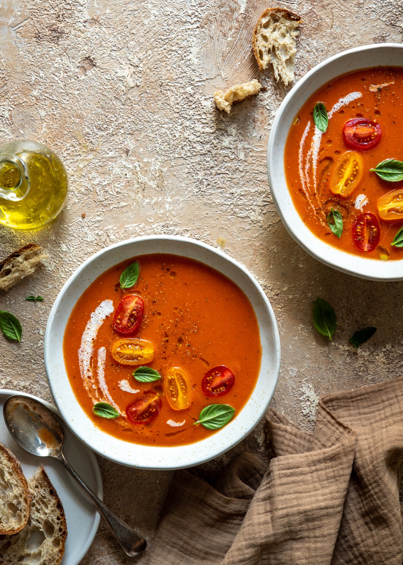 Recipe for roasted tomato soup, garnished with cherry tomatoes and basil