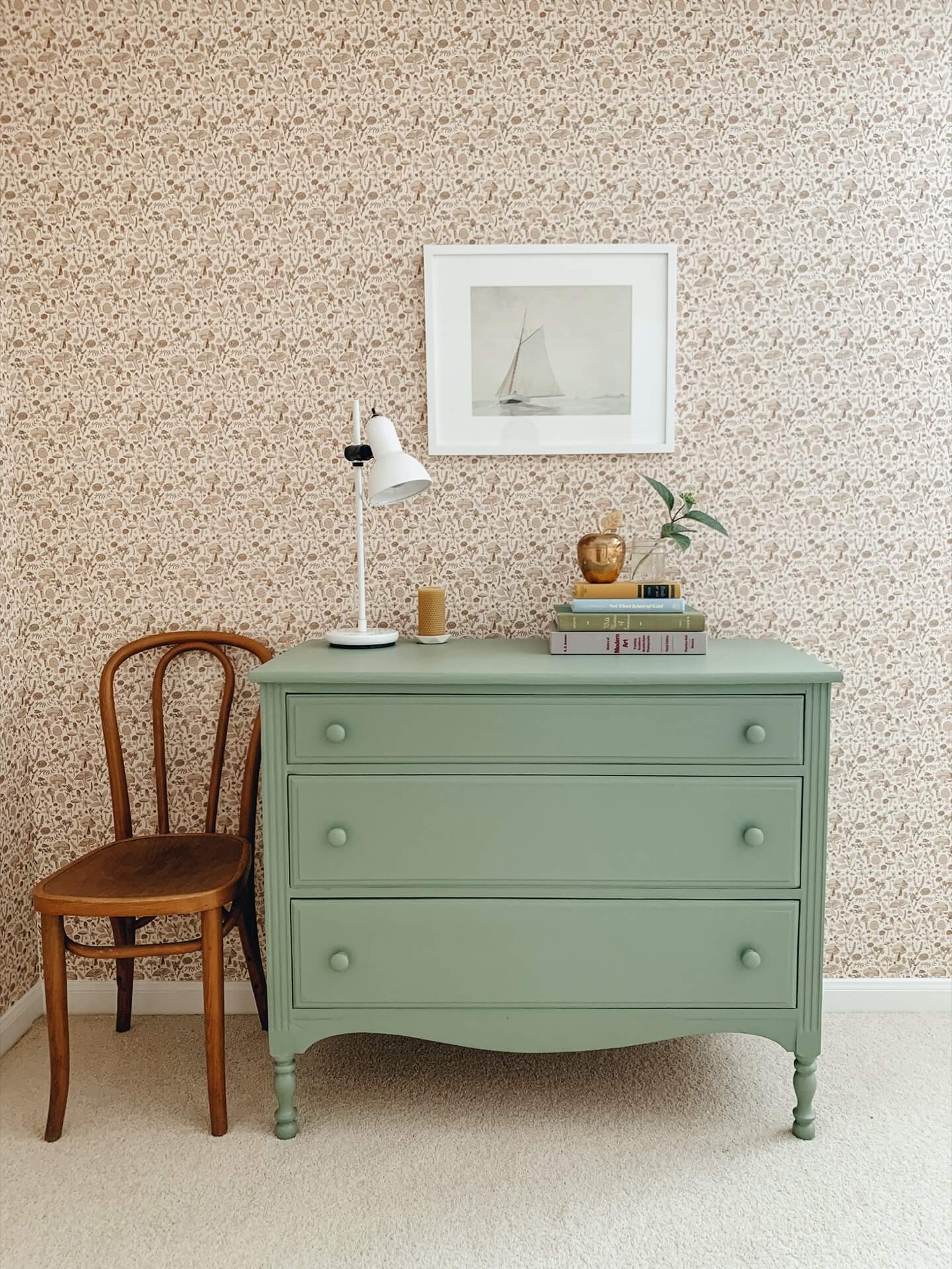 Home tour with Leah Gaeddert - green painted vintage drawers against a background of ditsy floral wallpaper