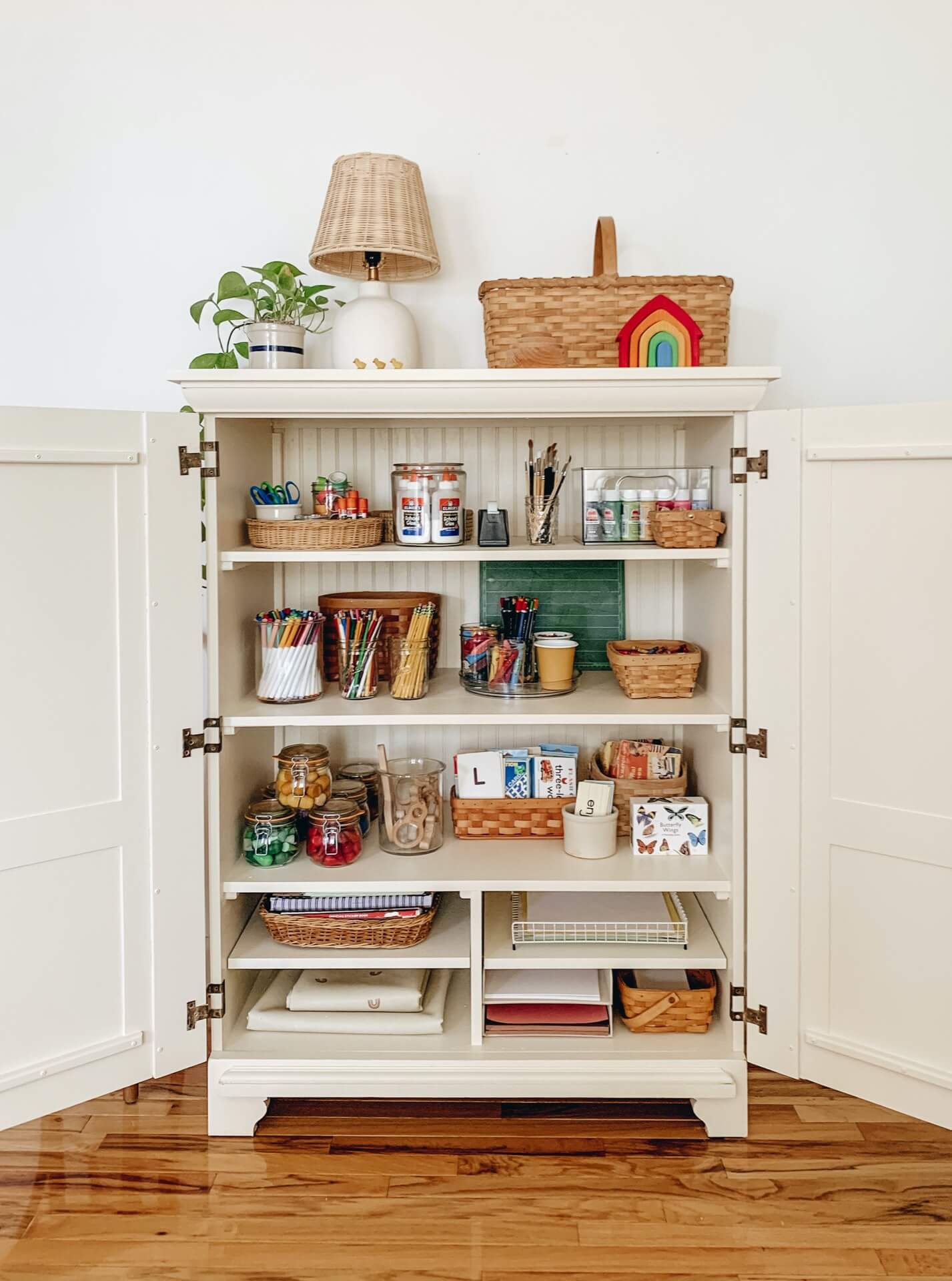 Home tour with Leah Gaeddert - a large vintage cabinet filled with well organised art supplies for kids