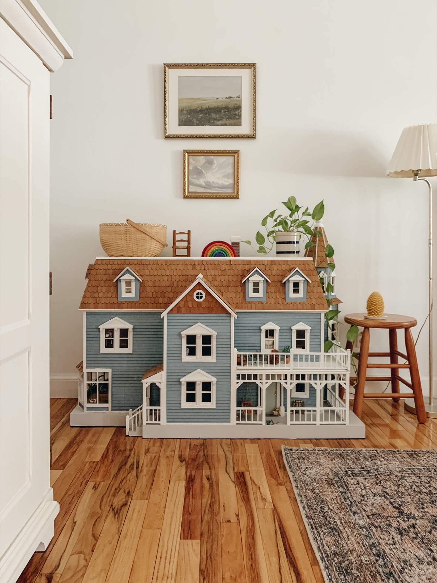 Home tour with Leah Gaeddert - a beautiful dolls house is displayed in one room. 