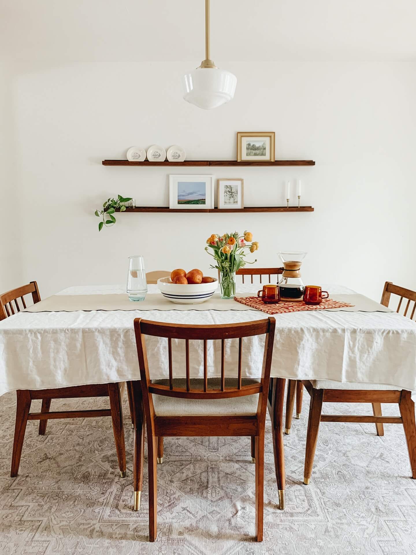 Home tour with Leah Gaeddert - dining table with wooden chairs 