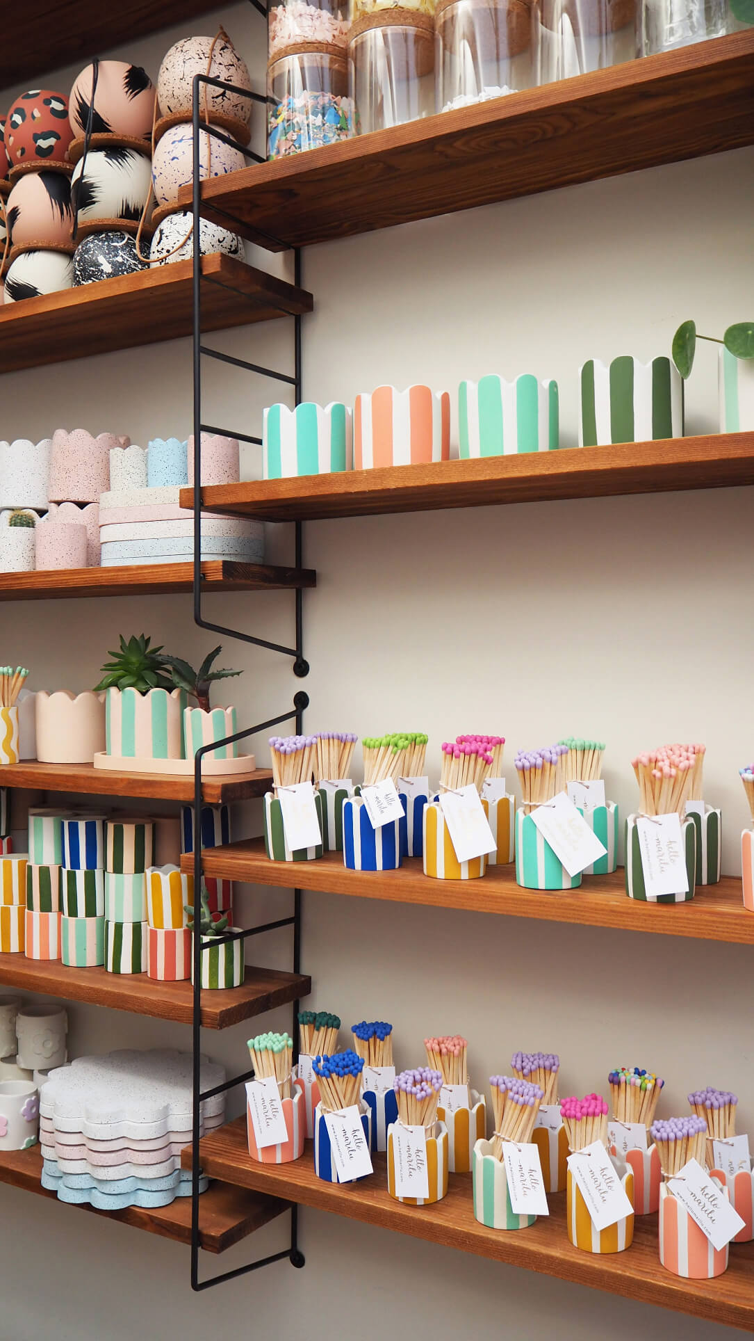 Stripey match pots and plant pots inside independent maker Hello Marilu's home studio
