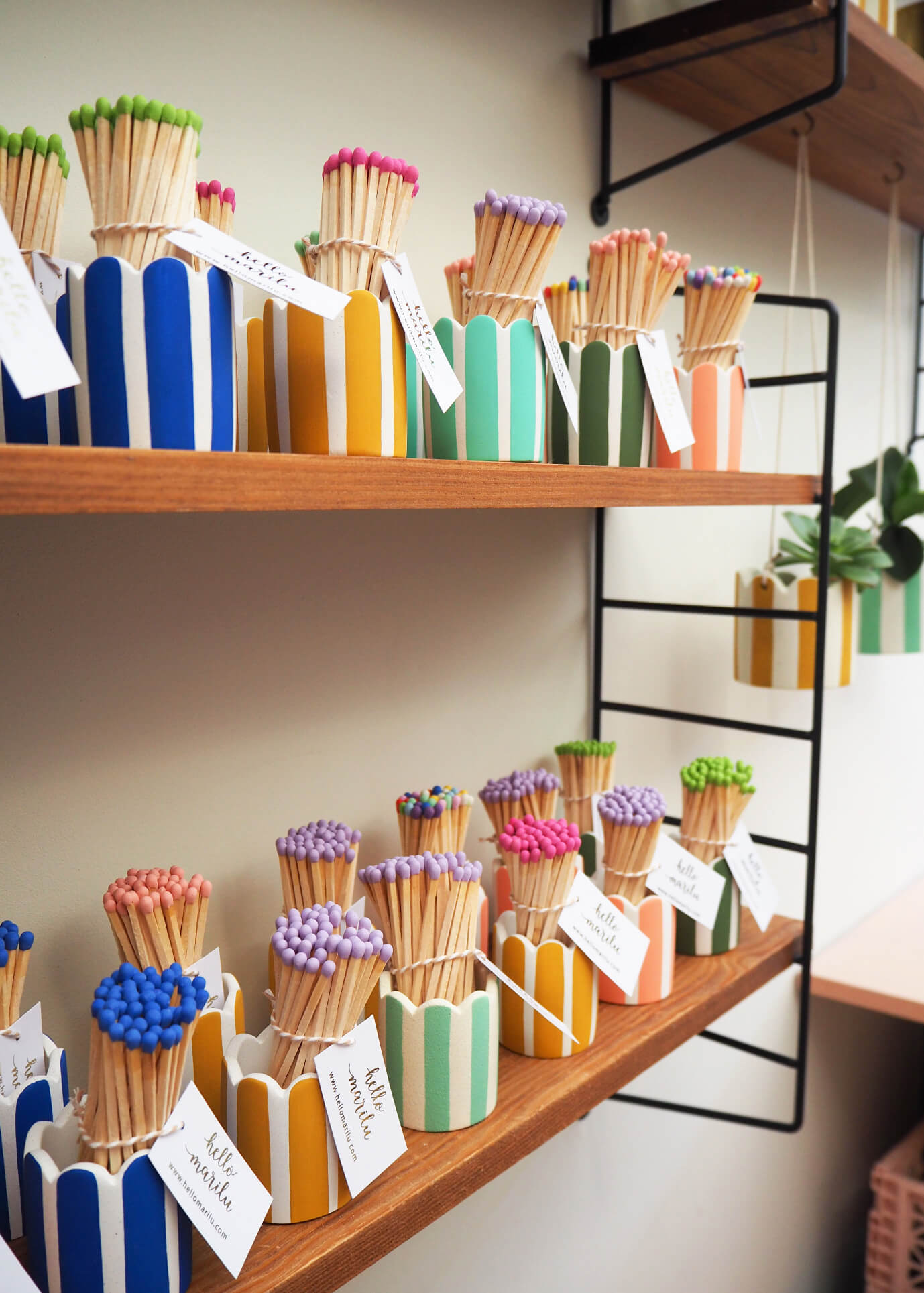 Stripey match pots inside independent maker Hello Marilu's home studio