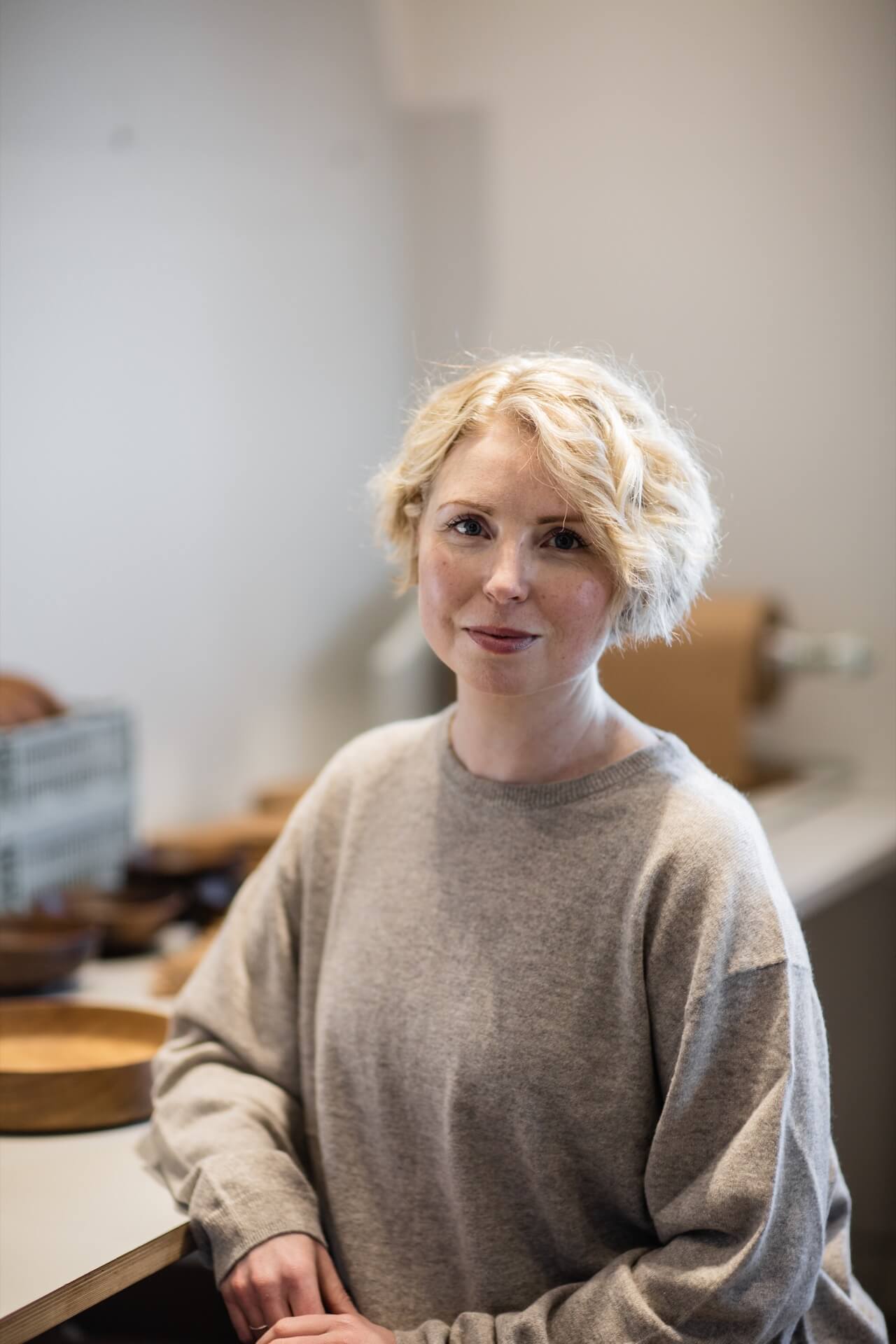 Nina Varnham founder of Fryth sustainable wooden homeware, inside her Devon workshop
