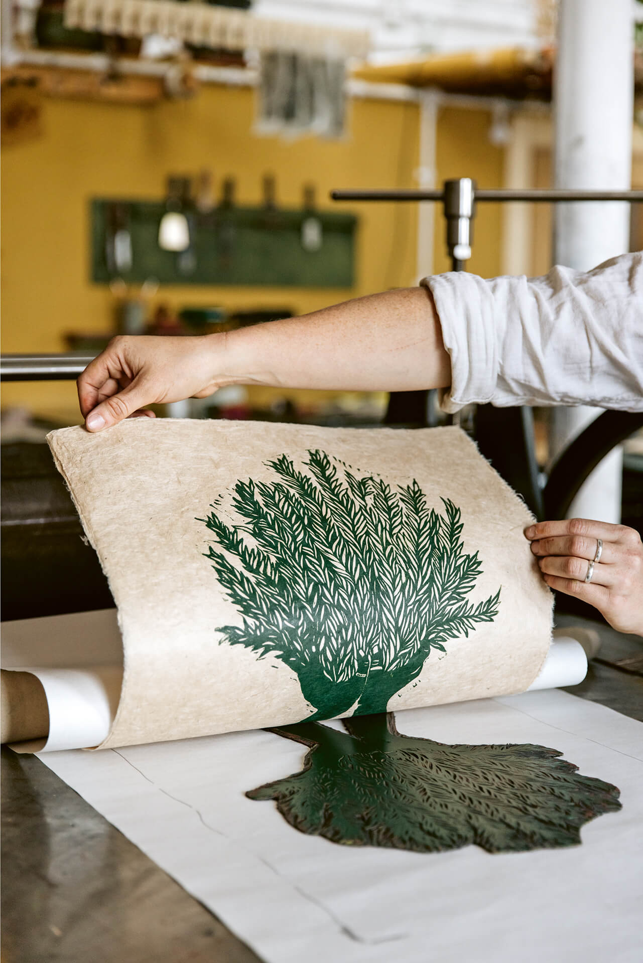 Printmaker Rosanna Morris in her studio. 91 Magazine reviews her book, Botanical Block Printing.
